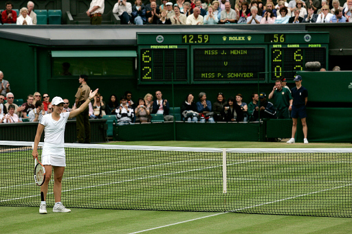 WIMBLEDON 2007
Justine Henin (BEL) waves to the crowd after beating Patty Schnyder (SUI), Women's Round 4, Day 7.
Photo: Glyn Kirk / AELTC
2-7-2007